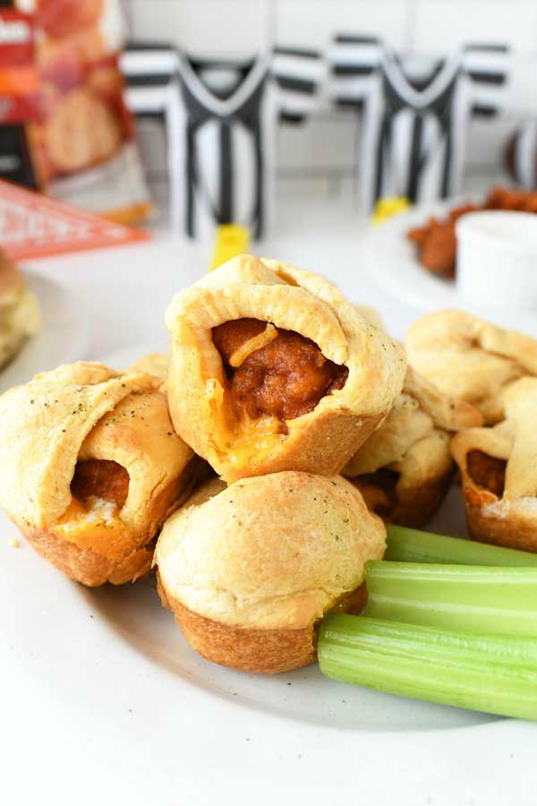 Buffalo Chicken Crescent Bites on a plate with celery.