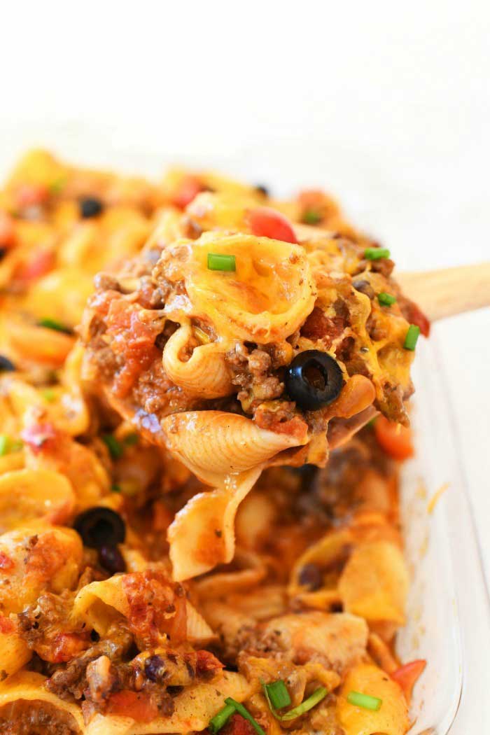 Taco Pasta Casserole in a wooden spoon.