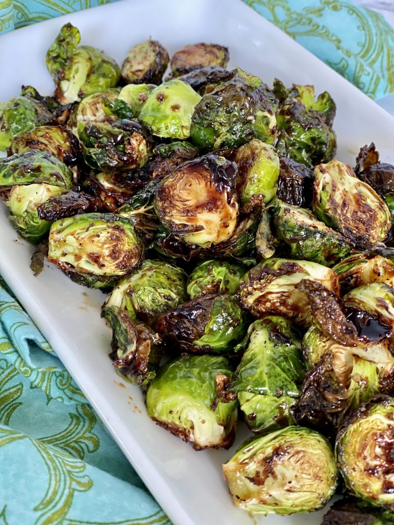 air fryer balsamic brussels sprout in white rectangular dish