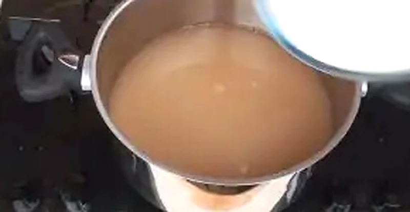 Step 6: Adding granulated sugar and fresh lemon juice to apple juice in pan